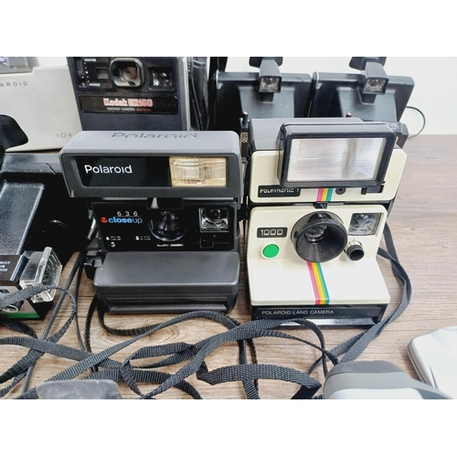 952 - Twelve instant cameras to include Polaroid The Button, Polaroid P, Kodak EK160, Polaroid Land camera... 