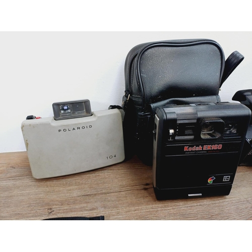 952 - Twelve instant cameras to include Polaroid The Button, Polaroid P, Kodak EK160, Polaroid Land camera... 