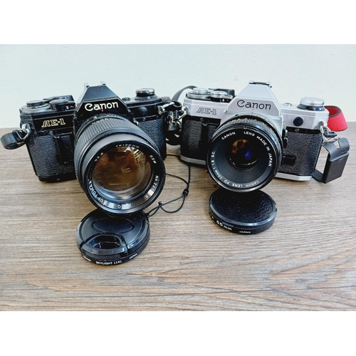 951 - Two Canon AE-1 35mm SLR cameras, one fitted with Optomax 1:2.8 135mm lens and one fitted with FD S.C... 