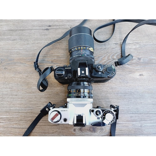 951 - Two Canon AE-1 35mm SLR cameras, one fitted with Optomax 1:2.8 135mm lens and one fitted with FD S.C... 