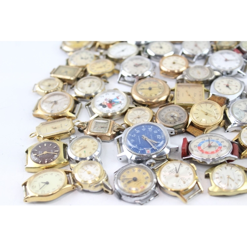 2077 - Approx. sixty hand wind lady's watch heads