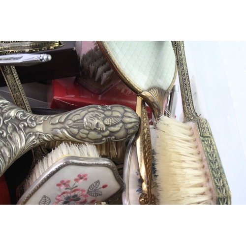 731 - A collection of lady's vanity items to include mirror, brush etc.