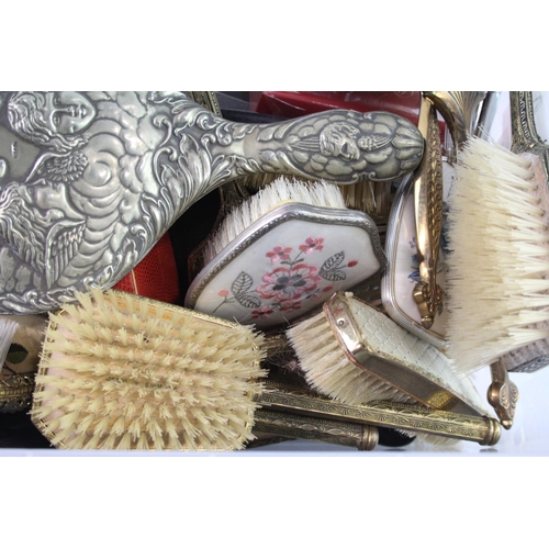 731 - A collection of lady's vanity items to include mirror, brush etc.