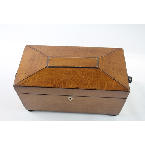 785 - A Georgian inlaid mahogany tea caddy