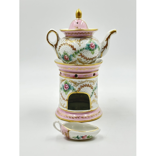 538 - A French Sevres style hand painted porcelain Veilleuse teapot - approx. 22cm high