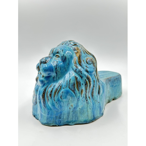 539 - A 19th century style blue drip glazed ceramic lion sash window support - approx. 16cm high x 14cm wi... 