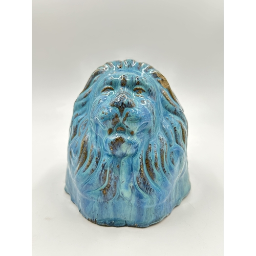 539 - A 19th century style blue drip glazed ceramic lion sash window support - approx. 16cm high x 14cm wi... 