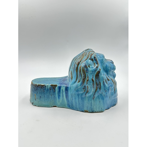 539 - A 19th century style blue drip glazed ceramic lion sash window support - approx. 16cm high x 14cm wi... 