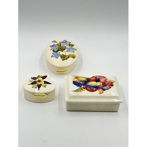 540 - Three Moorcroft trinket boxes - largest approx. 4.5cm high x 12cm wide x 19cm deep