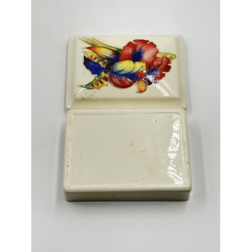 540 - Three Moorcroft trinket boxes - largest approx. 4.5cm high x 12cm wide x 19cm deep