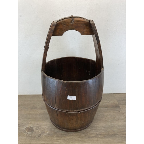 3 - An early 20th century Chinese elm well bucket - approx. 65cm high x 32cm diameter