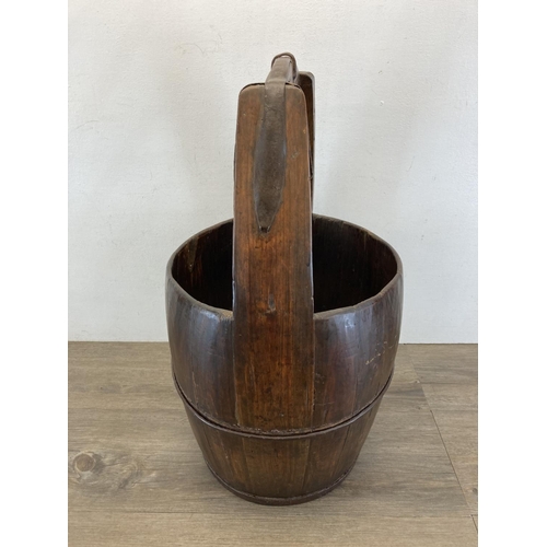 3 - An early 20th century Chinese elm well bucket - approx. 65cm high x 32cm diameter