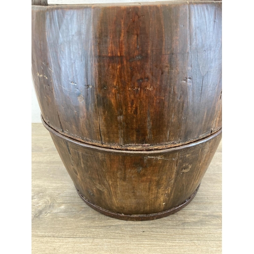 3 - An early 20th century Chinese elm well bucket - approx. 65cm high x 32cm diameter