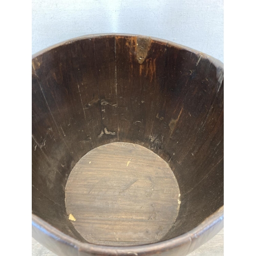 3 - An early 20th century Chinese elm well bucket - approx. 65cm high x 32cm diameter