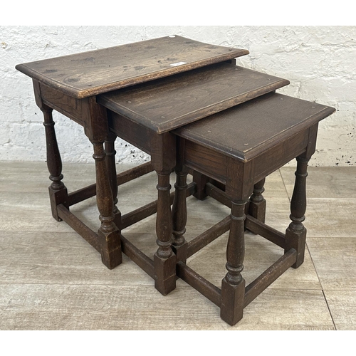 81 - Two pieces of furniture, one 17th century style oak nest of tables and one Edwardian inlaid mahogany... 