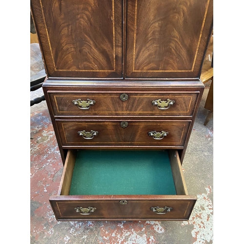 84 - A Georgian style inlaid mahogany TV cabinet - approx. 137cm high x 60cm wide x 42cm deep