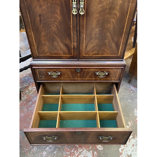 84 - A Georgian style inlaid mahogany TV cabinet - approx. 137cm high x 60cm wide x 42cm deep