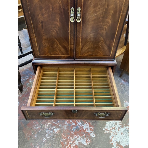 84 - A Georgian style inlaid mahogany TV cabinet - approx. 137cm high x 60cm wide x 42cm deep