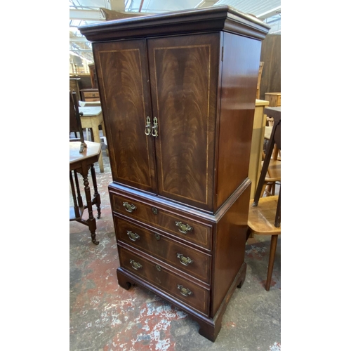 84 - A Georgian style inlaid mahogany TV cabinet - approx. 137cm high x 60cm wide x 42cm deep
