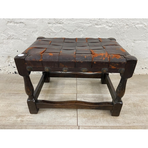 85 - Two items, one early 20th century beech twin handled tray and one beech and brown leather footstool