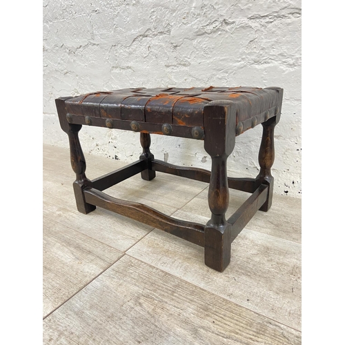 85 - Two items, one early 20th century beech twin handled tray and one beech and brown leather footstool