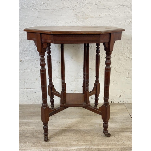 86 - A Victorian walnut octagonal two tier side table - approx. 70cm high x 59cm wide x 59cm deep