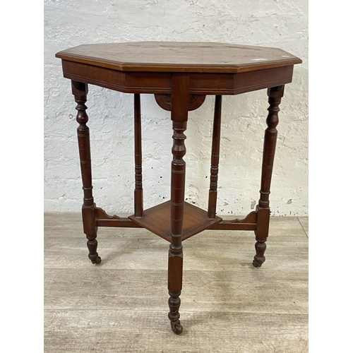 86 - A Victorian walnut octagonal two tier side table - approx. 70cm high x 59cm wide x 59cm deep