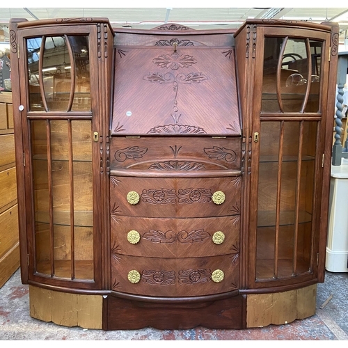 109 - An early/mid 20th century stained and carved oak side by side bureau bookcase - approx. 122cm high x... 
