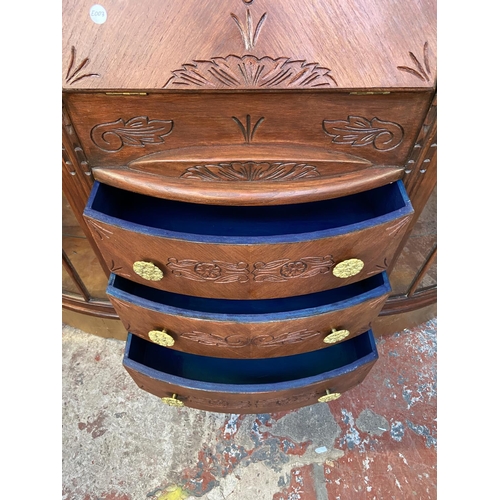 109 - An early/mid 20th century stained and carved oak side by side bureau bookcase - approx. 122cm high x... 