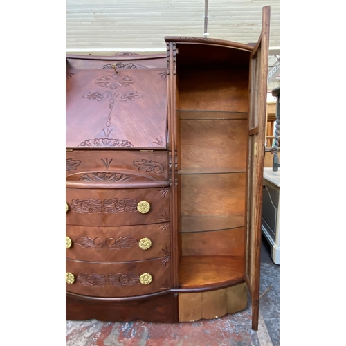 109 - An early/mid 20th century stained and carved oak side by side bureau bookcase - approx. 122cm high x... 