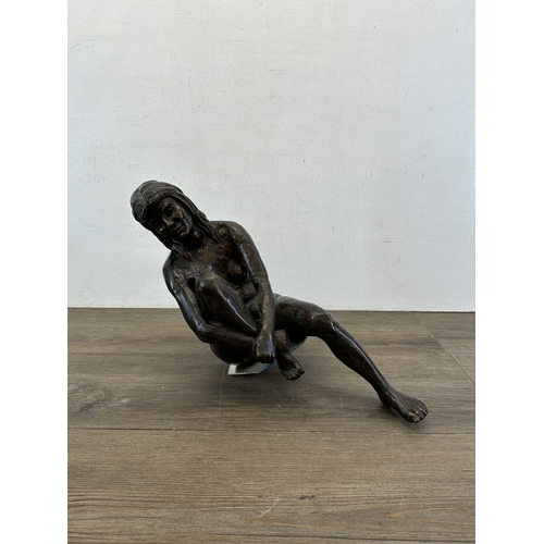 773 - A hand finished cold cast bronzed resin female seated nude figurine - approx. 45cm high