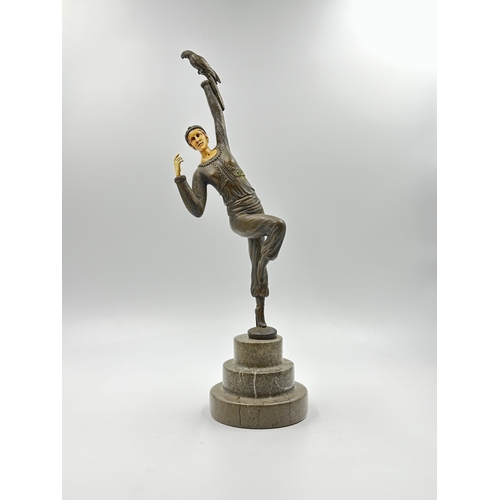 774A - An Art Deco style cast bronze sculpture after D.H.Chiparus depicting a woman with bird in hand - app... 