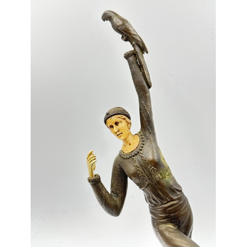 774A - An Art Deco style cast bronze sculpture after D.H.Chiparus depicting a woman with bird in hand - app... 