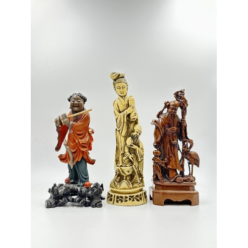 786 - Three Oriental figurines, two resin and one carved wooden and lacquered - largest approx. 28cm high