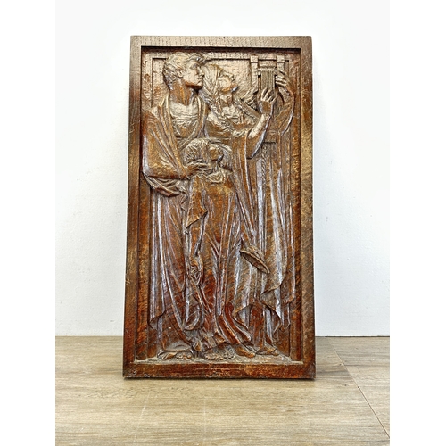 788 - A Haute Epoque style carved wooden plaque of a religious scene - approx. 64cm high x 35cm wide