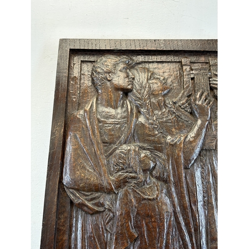 788 - A Haute Epoque style carved wooden plaque of a religious scene - approx. 64cm high x 35cm wide