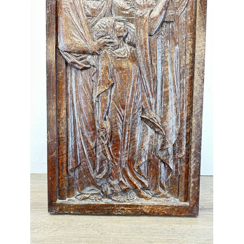 788 - A Haute Epoque style carved wooden plaque of a religious scene - approx. 64cm high x 35cm wide