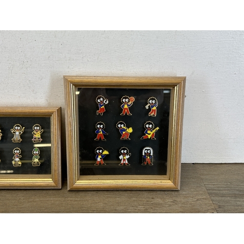 790 - Four display cases containing a collection of Robertson's advertising pin badges together with a 200... 