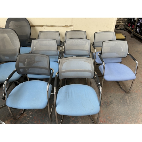 320 - Eight modern tubular metal desk chairs with blue fabric seats and grey mesh back rest