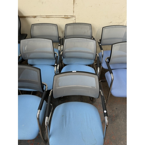 320 - Eight modern tubular metal desk chairs with blue fabric seats and grey mesh back rest