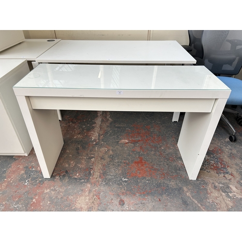 323 - An IKEA Malm white laminate office desk with glass top - approx. 78cm high x 120cm wide x 41cm deep