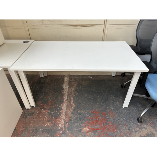 324 - A modern white laminate office desk - approx. 72cm high x 140cm wide x 92cm deep