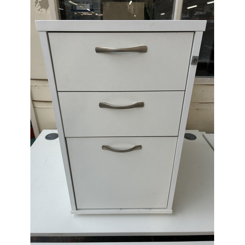 325 - A modern white laminate three drawer office filing cabinet - approx. 74cm high x 43cm wide x 60cm de... 