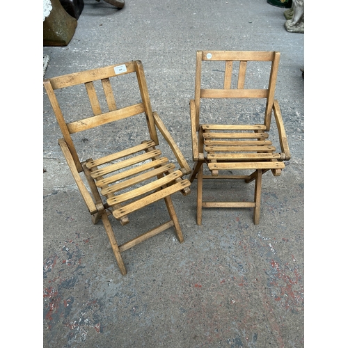 329 - A pair of mid 20th century beech folding child's chairs - approx. 58cm high