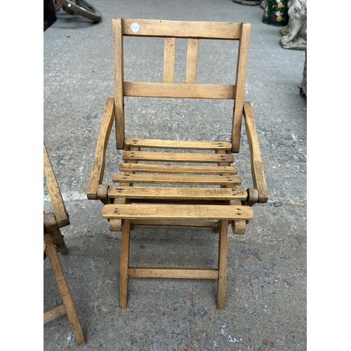 329 - A pair of mid 20th century beech folding child's chairs - approx. 58cm high