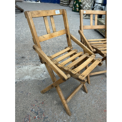 329 - A pair of mid 20th century beech folding child's chairs - approx. 58cm high