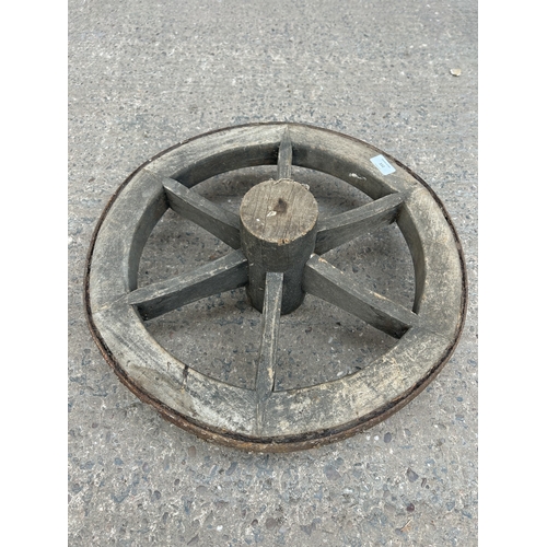 332 - An antique wood and metal cart wheel - approx. 50cm diameter