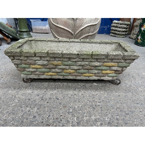 344 - Two items, one cast stone brick wall effect rectangular garden planter on wrought metal supports and... 