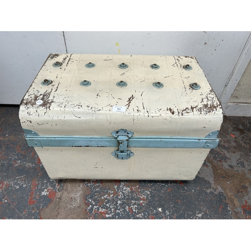 353 - An early 20th century painted metal travel trunk - approx. 42cm high x 59cm wide x 42cm deep
