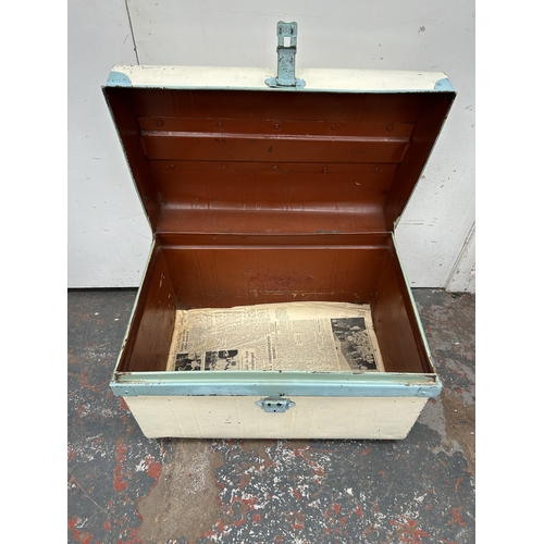 353 - An early 20th century painted metal travel trunk - approx. 42cm high x 59cm wide x 42cm deep